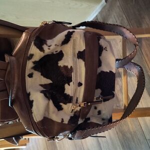Jen and Co cow print backpack